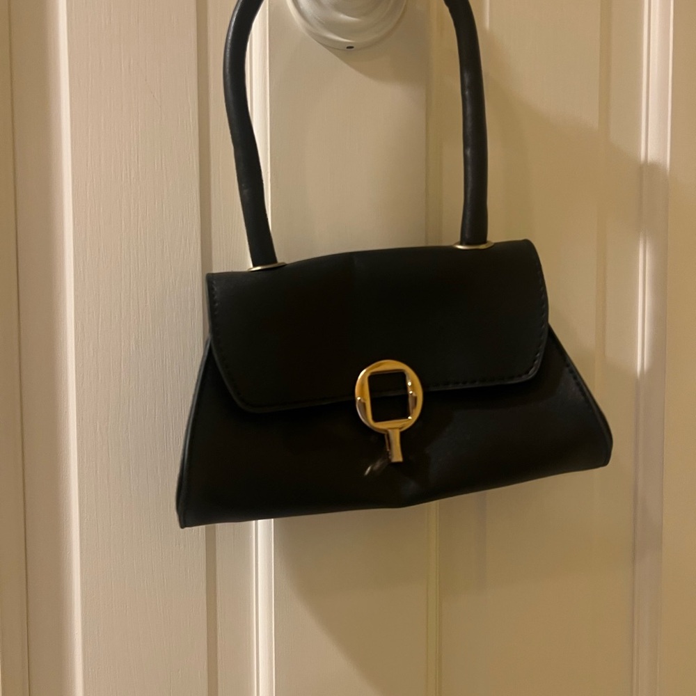 Elegant Black Handbag with Gold Accent